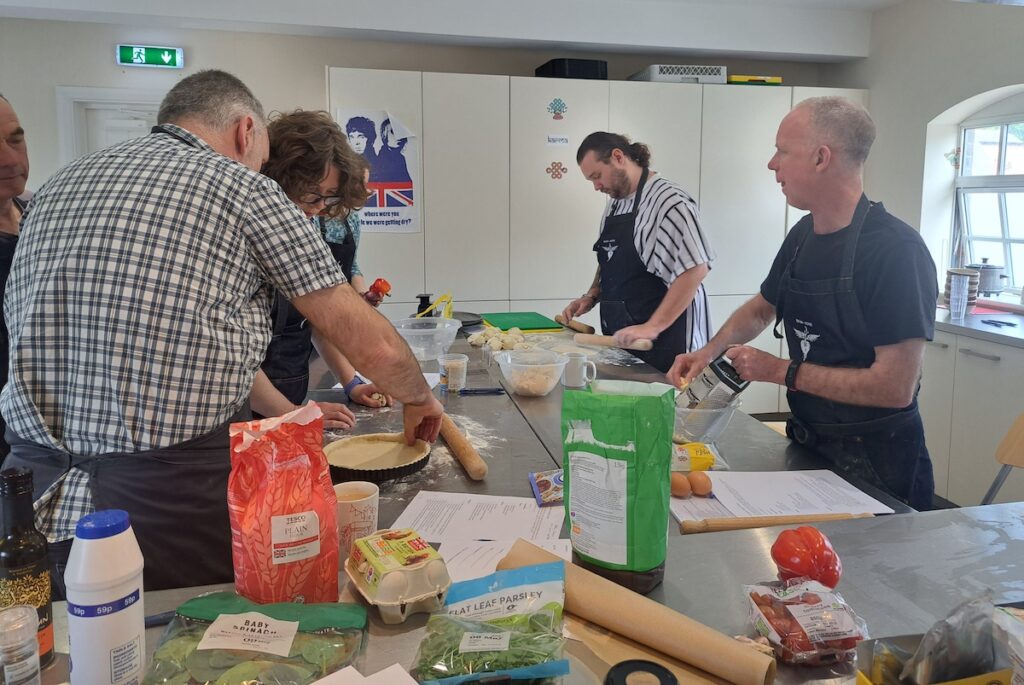 a group of people cooking together