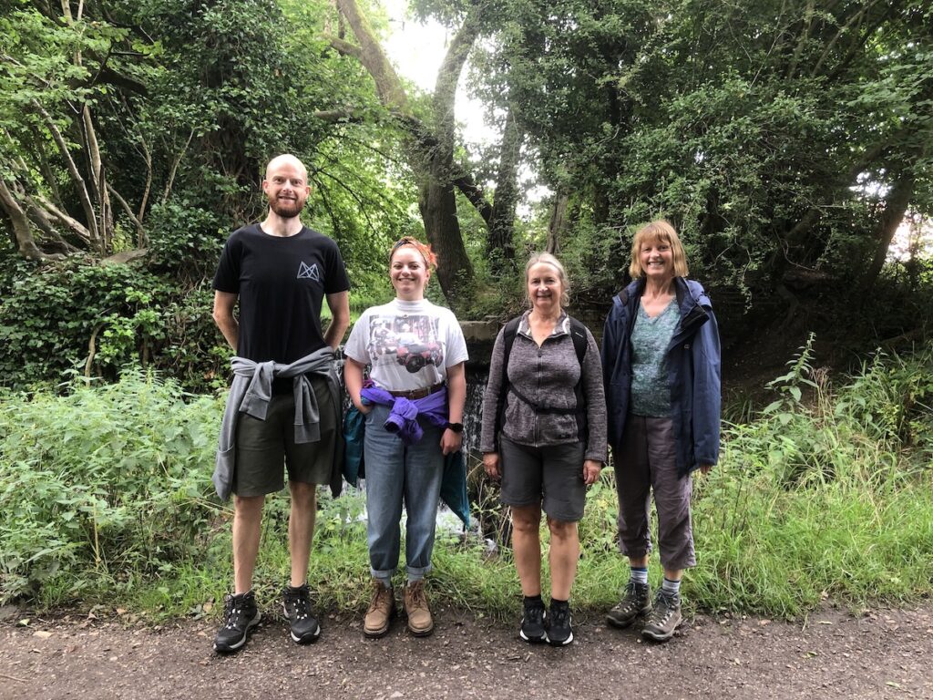 a group of four hikers posing